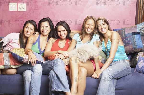 Group of women sitting on couch