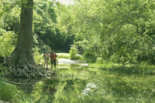 Young couple standing in a forest