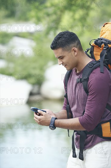 Young man holding a mobile phone