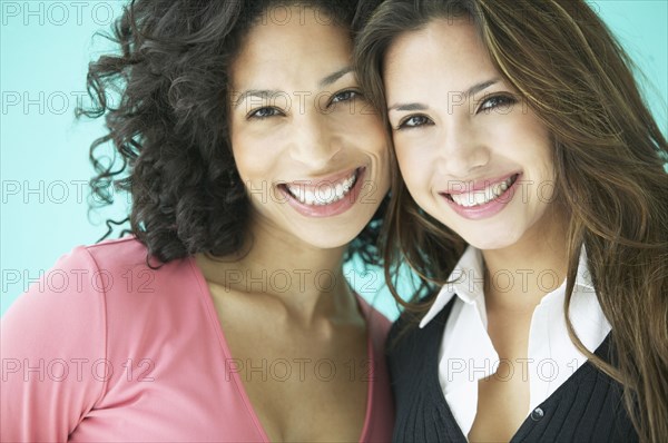 Two women hugging and smiling