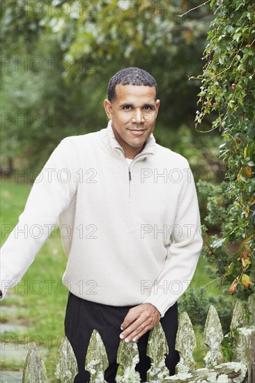 Man smiling for the camera outdoors