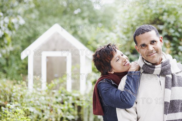 Young couple hugging outdoors