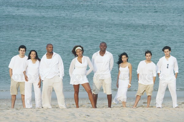 Friends posing for the camera on the beach