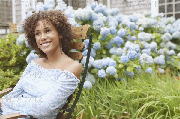 Young woman relaxing in a lawn chair