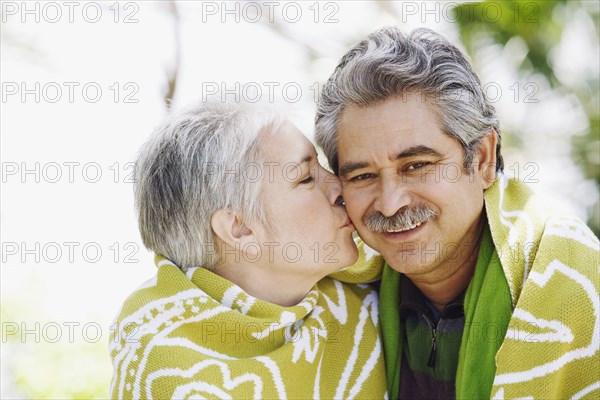 Middle-aged couple kissing