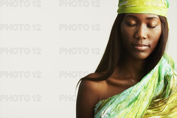Studio shot of African woman with eyes closed