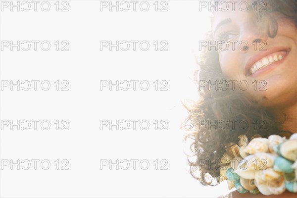 Woman wearing seashell necklace