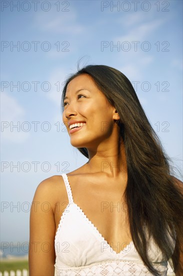 Asian woman looking to side