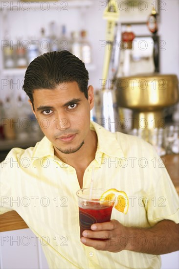 Egyptian man drinking at bar