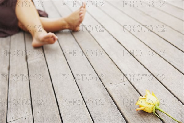 Woman and flower on deck