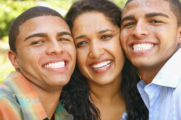 Hispanic siblings hugging