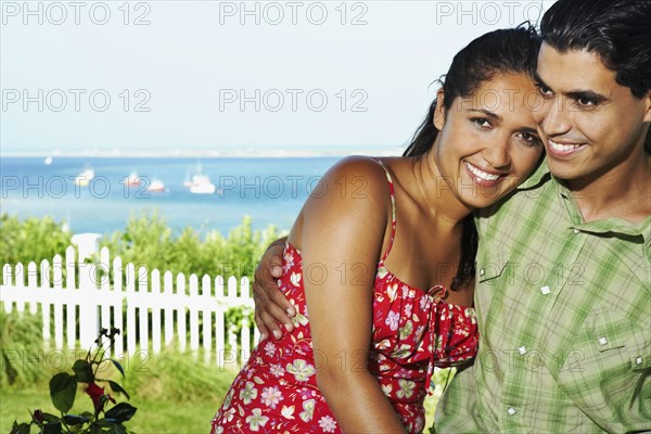 Young couple hugging outdoors