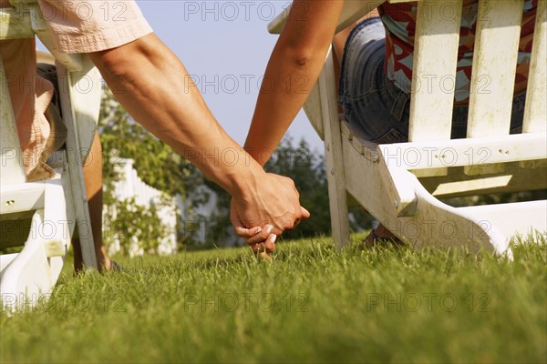 Close up of couple holding hands