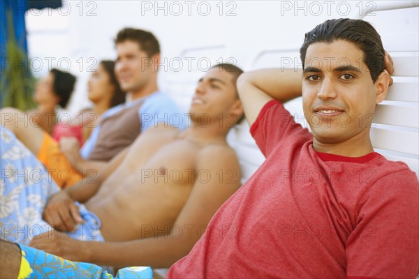 Young man in lounge chair