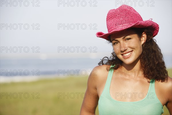 Young woman wearing hat at beach