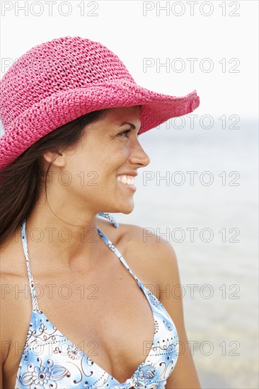 Young woman wearing hat at beach