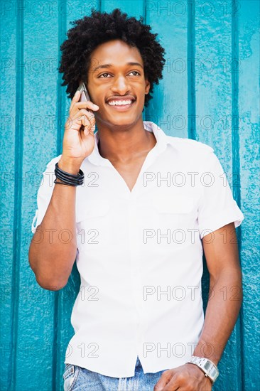 African man talking on cell phone