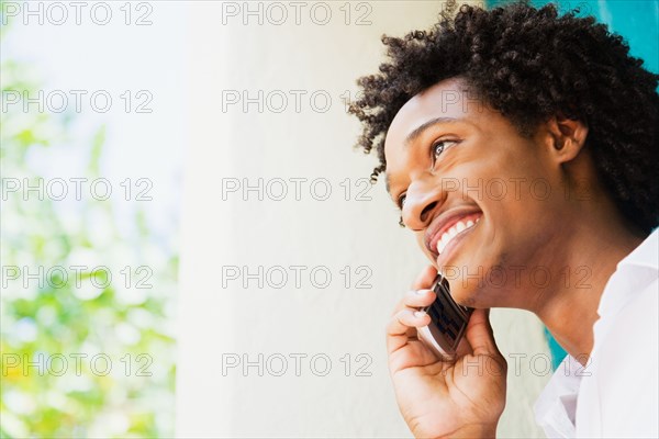 African man talking on cell phone