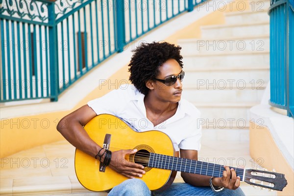 African man playing guitar