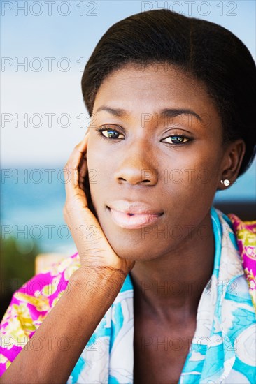 African woman with head in hands