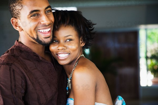 African couple hugging