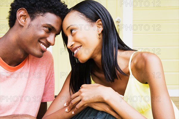 African couple smiling face to face