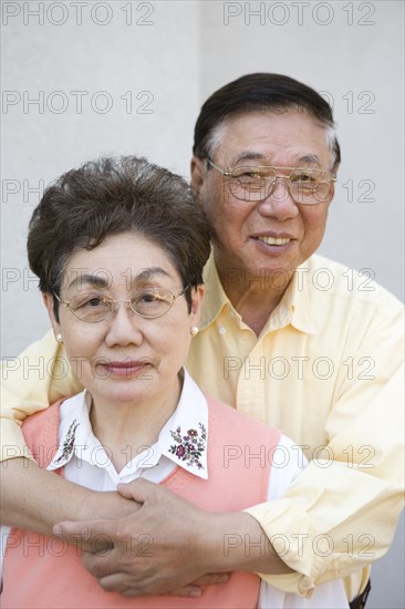 Senior Chinese couple hugging