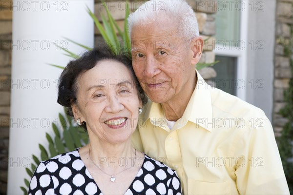 Smiling senior Chinese couple