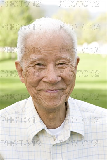Smiling senior Chinese man