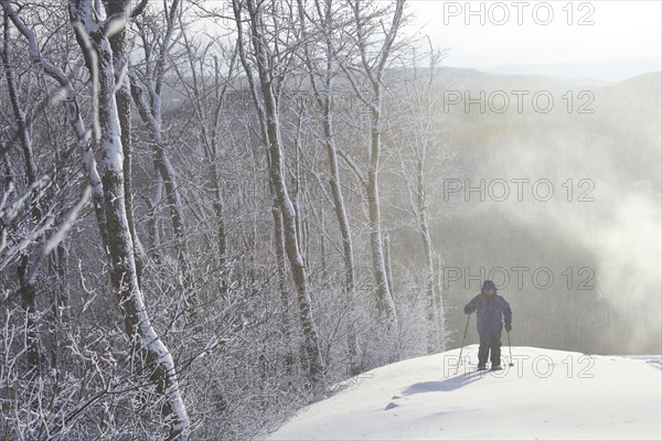 Caucasian man snowshoeing