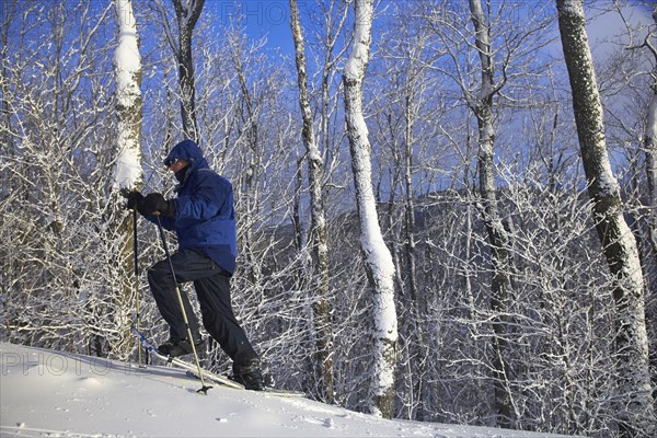 Caucasian man snowshoeing