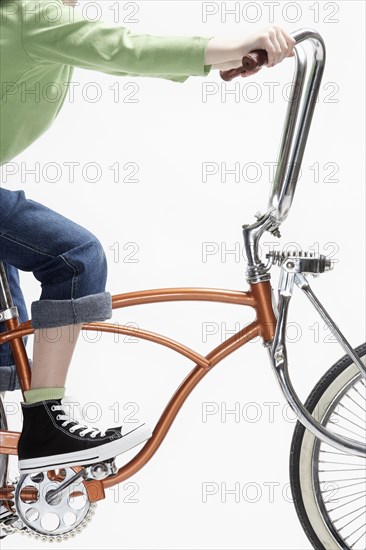 Caucasian girl riding bicycle