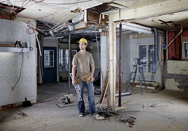 Caucasian construction worker in hard hat on site