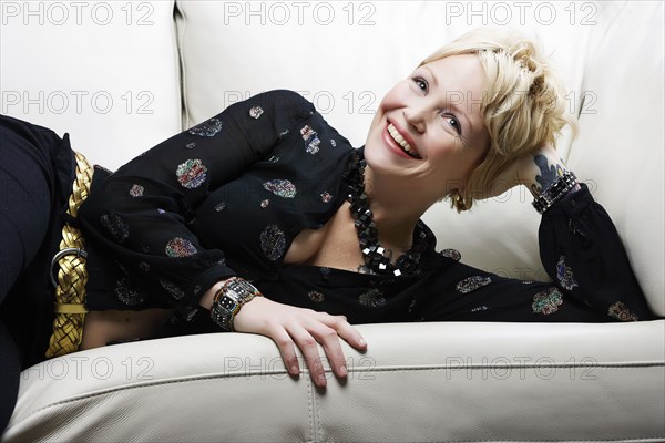 Caucasian woman laying on sofa