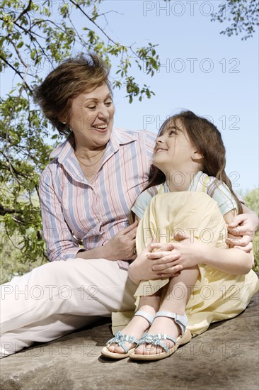 Senior Caucasian woman and granddaughter in park