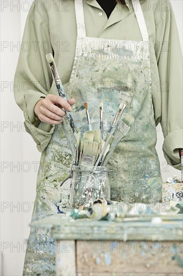 Caucasian painter working in studio