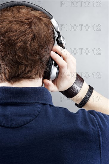 Caucasian man listening to headphones