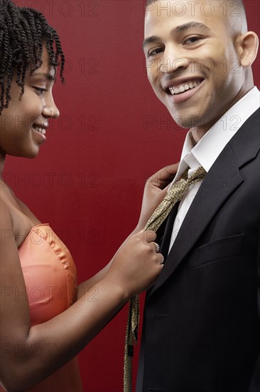 Couple admiring each other in formalwear