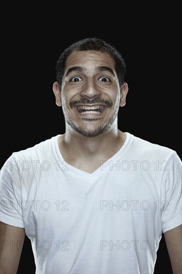 Portrait of excited man smiling