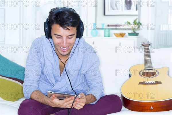 Mixed race teenager using digital tablet