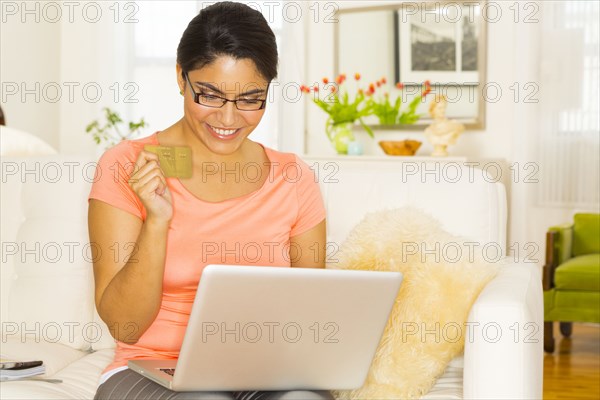 Hispanic woman shopping online