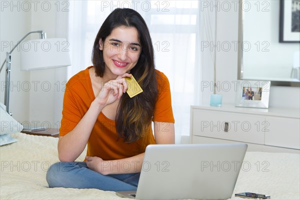 Hispanic woman shopping online