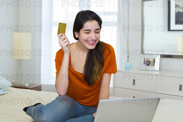 Hispanic woman shopping online