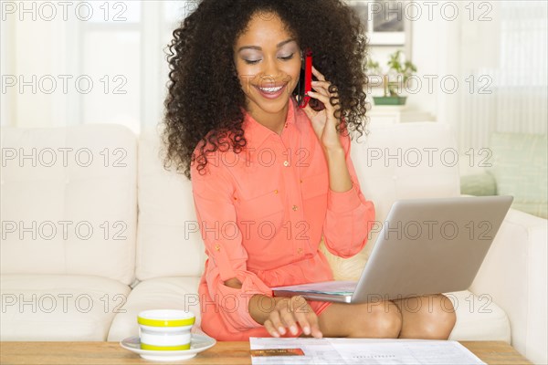 Mixed race woman shopping online