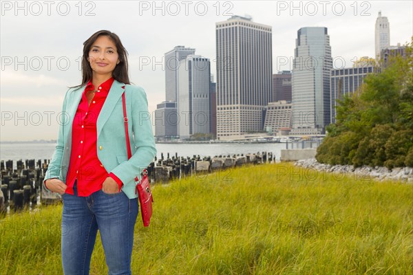 Mixed race woman smiling in park