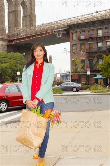 Mixed race woman with shopping bag