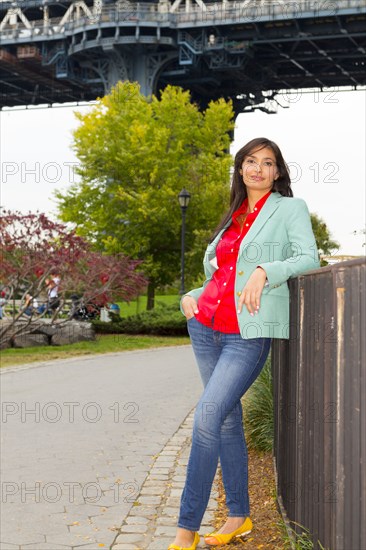 Mixed race woman standing on urban sidewalk