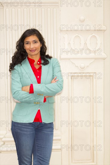 Mixed race woman smiling outside building
