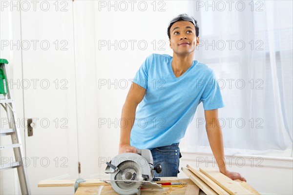 Mixed race carpenter thinking