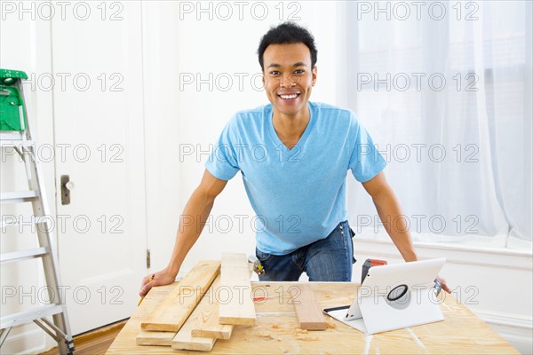 Mixed race carpenter working